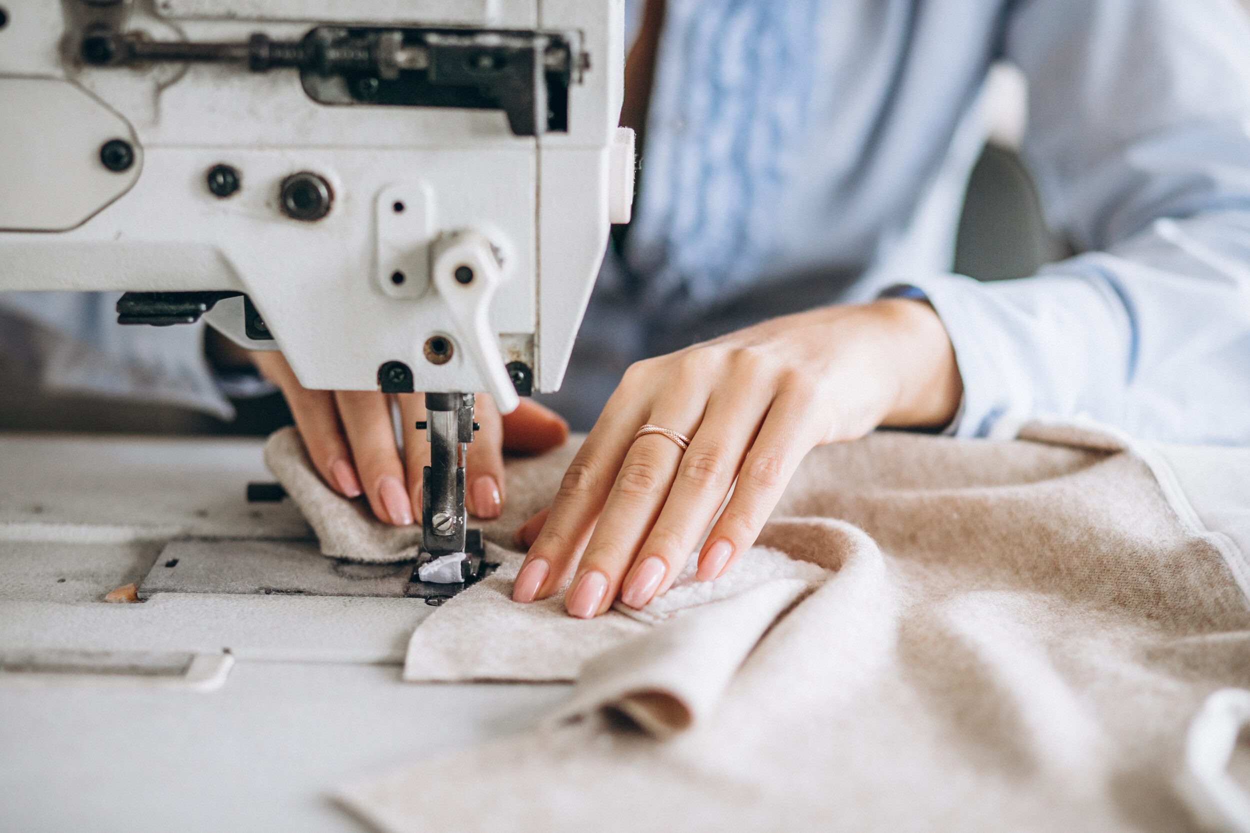 Tailor sewing precision prototype in KBK Exports sample room Jaipur India